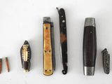 five different types of knives on a white surface