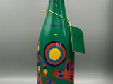 an image of a green bottle with a colorful design on it
