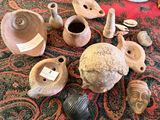 many different types of pottery on the table