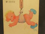 une vieille carte postale sur laquelle figure la photo d'un bébé