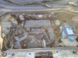 a picture of a car engine with a battery in it