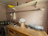 a kitchen with a sink and a stove in it