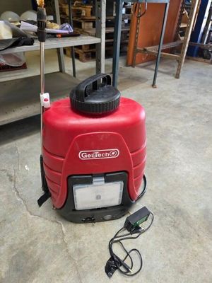 a red machine that is sitting on the floor