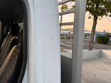 a white truck with black seats in the back of it