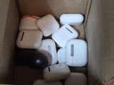 a box full of airpods sitting on the floor