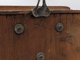 an old wooden chest with a metal latch on the top