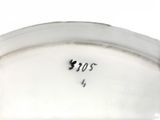 a close up of a white plate with a black writing on it