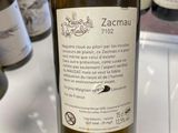 a bottle of wine sitting on a table in a store