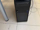 a computer on a desk with a lot of wires