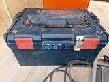 an image of a tool box sitting on the floor with a cord in it