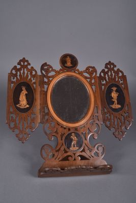 an image of a mirror with a picture of a man and a woman on it