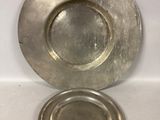 a silver plate that is sitting on top of a table
