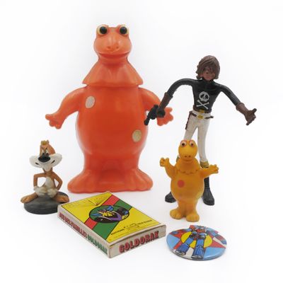 toy figurines of a man, a dog, a cat, and a frog