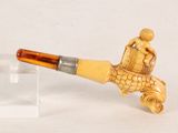 a picture of a pipe with a man sitting on top of it