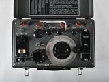 a close up of a black electronic device on a white surface