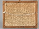 an old wooden box with a rope wrapped around it on a gray surface