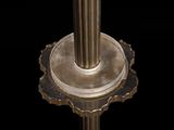 a close up of a metal object with a black background