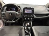 the interior of a small car with a steering wheel and dashboard