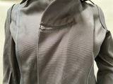a woman wearing a jacket with a zipper on it