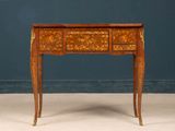 an image of a small wooden table with drawers on it