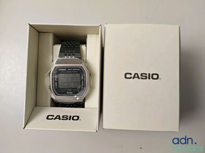 a close up of a casio watch in a box on a table