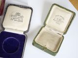 two boxes that have a ring inside of them
