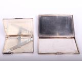 a silver case with a mirror on it and a knife in it