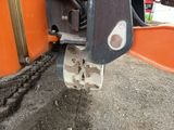 a close up of a machine that is working on the ground