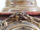 a close up of a clock with a clock face on it