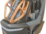a car seat that is attached to the back of a scooter
