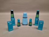 five different types of blue and green salt and pepper shakers