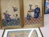 two framed pictures of a man and a woman sitting at a table