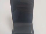 a cell phone that is sitting on top of a stand