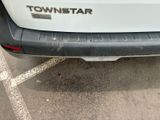 a white truck parked in a parking lot with a tow star sticker on it