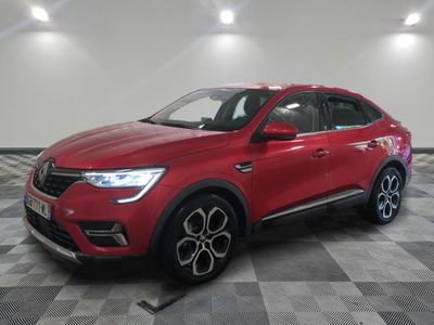 a red car parked in a garage with a checkered floor