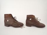 brown leather boots with laces and laces on the sole
