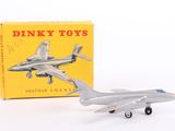 a toy airplane that is sitting next to a box