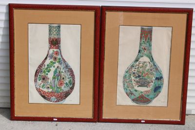 two framed pictures of vases on a wall in front of a house