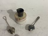 a few spoons that are sitting on a table
