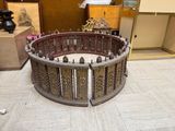 a large circular wooden table in the middle of a room