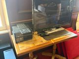 a desk with a laptop and a monitor on top of it