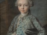 portrait of a young boy in a blue coat holding a fan