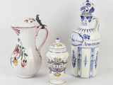 several different types of vases and containers are displayed on a white surface