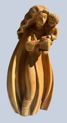 a statue of a woman holding a baby in her arms