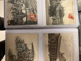 a person holding a book with pictures of a train
