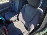 a car that has two seats in it and a baby seat in the back