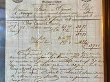 an old document with writing on it sitting on top of a table