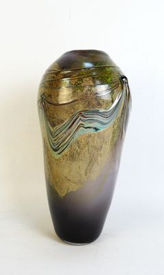 a vase that is sitting on a white surface