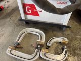 a couple of hoses that are sitting on the ground