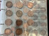 a lot of coins in a plastic container on a table